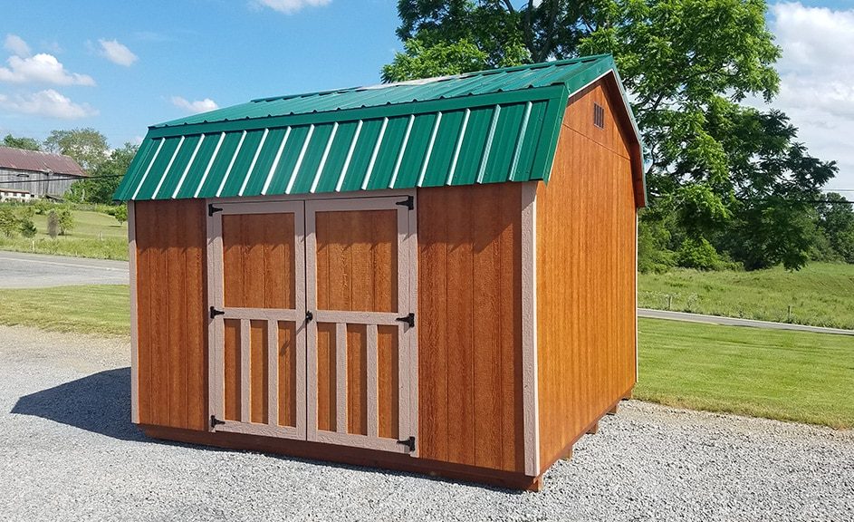 Highwall barn wood siding with mahogany stain, buckskin trim, and forest green metal roof