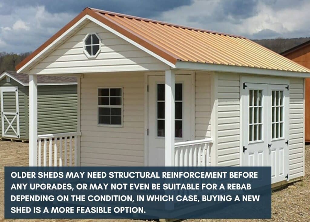 White shed with brown roof and front porch